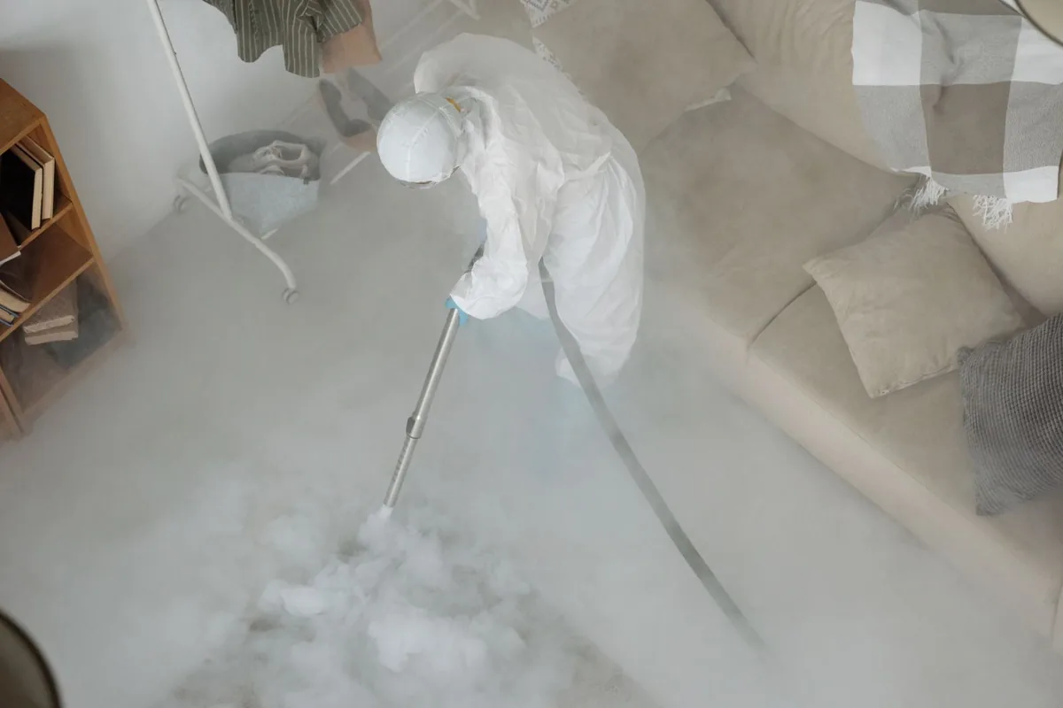 Biohazard cleanup technician in protective equipment, Winchester, OH